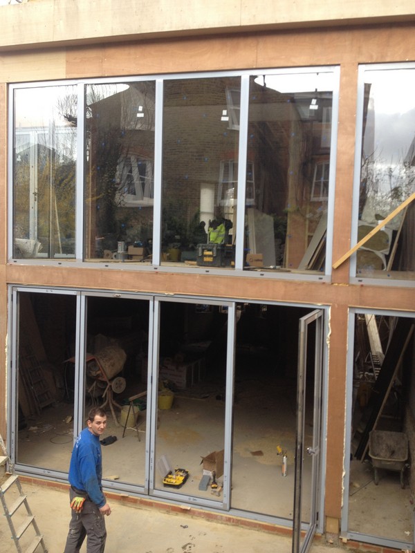 Aluminium bi-fold doors with two-storey glazing in South Norwood
