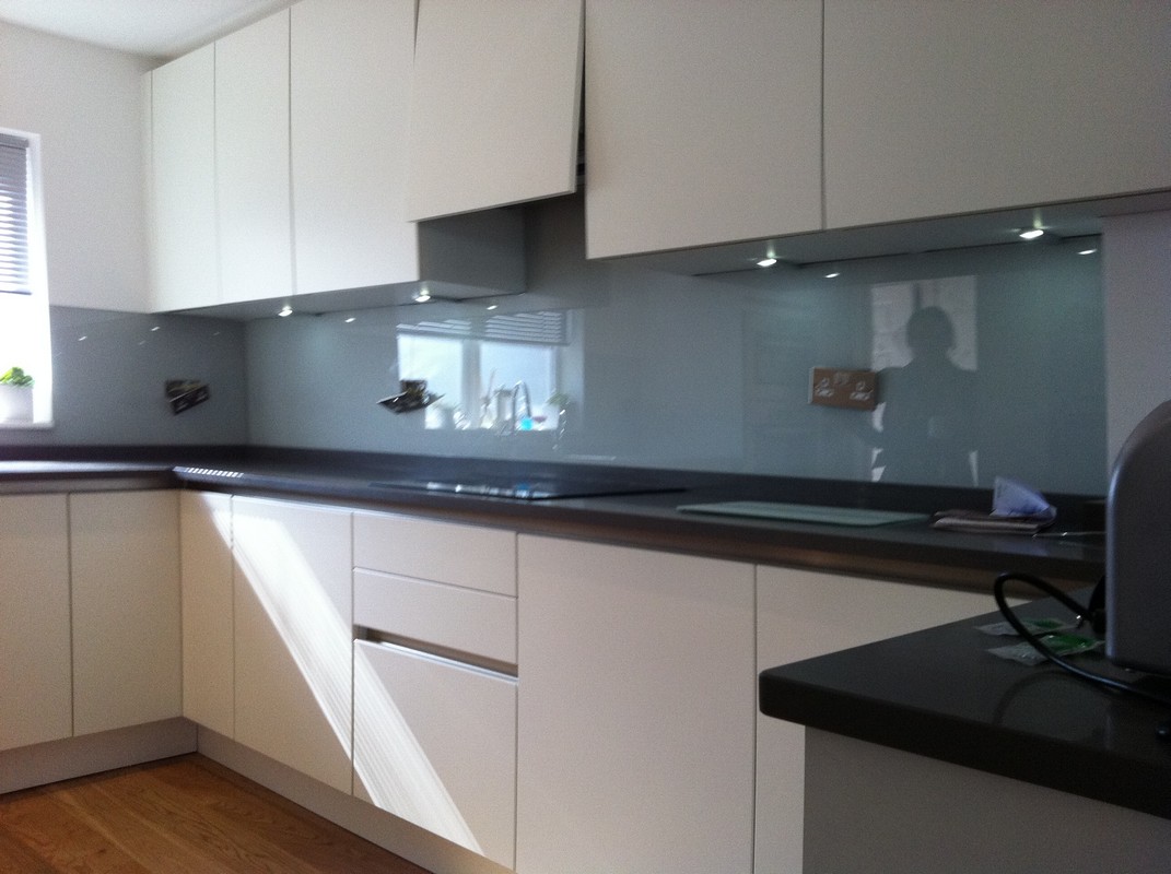Grey glass kitchen splashback with LED lighting in South Norwood