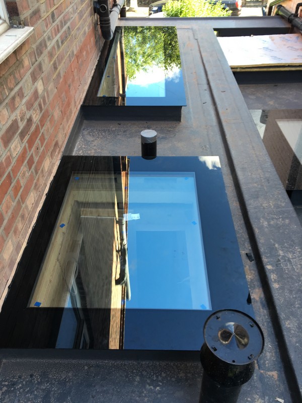 Multiple flat roof skylights on extension in South Norwood