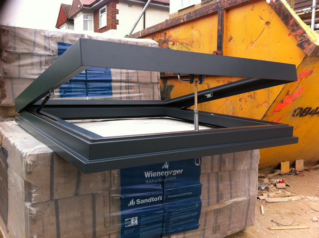 Opening flat roof skylight in anthracite grey installed in South Norwood