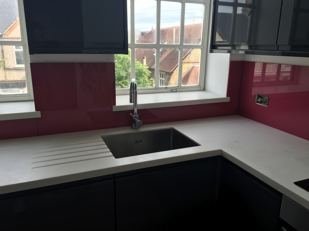 Deep plum coloured glass splashback in modern South Norwood kitchen